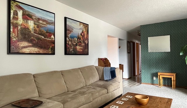 Comfortable, private home with large back yard in Olds